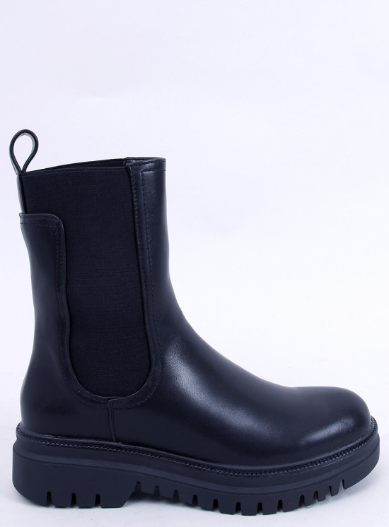 Black boots made of eco-leather on the platform