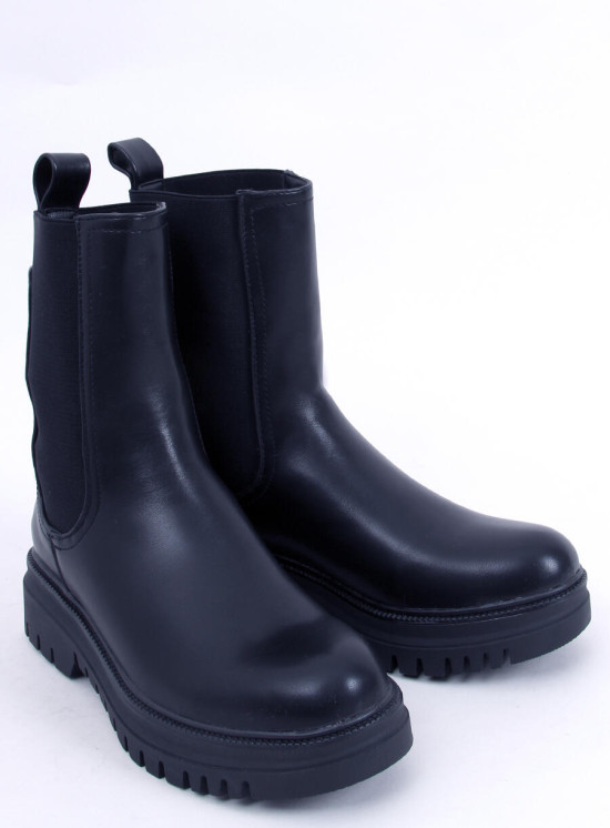 Black boots made of eco-leather on the platform