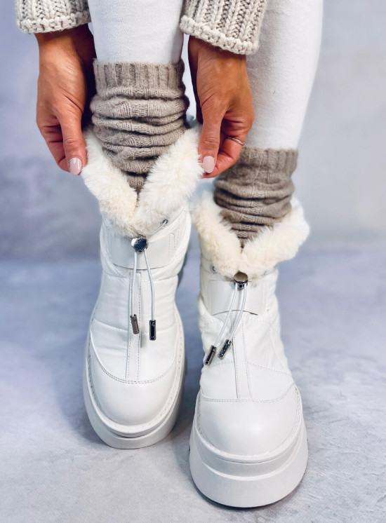 White snow shoes on a high platform