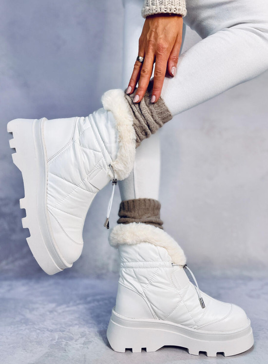 White snow shoes on a high platform