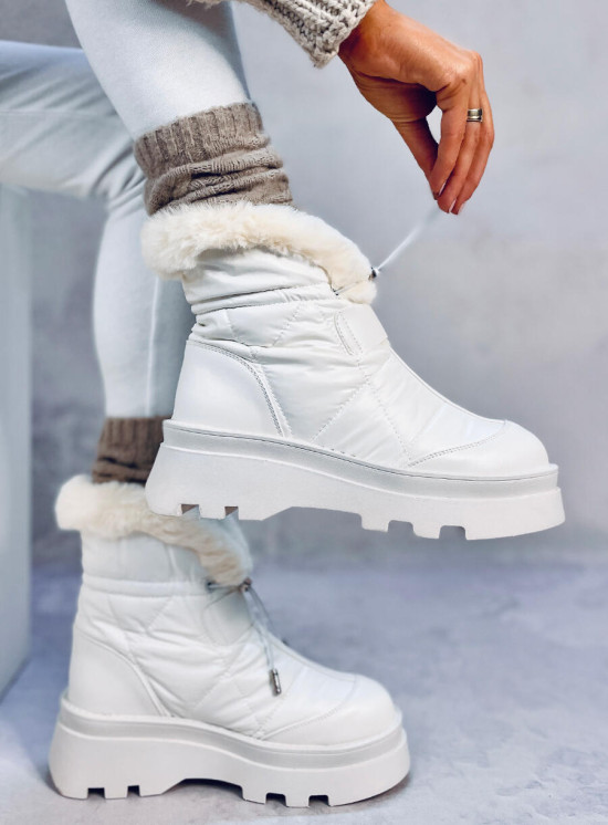 White snow shoes on a high platform