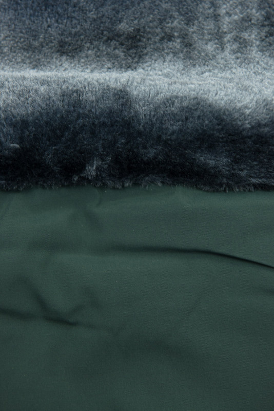 Green quilted winter jacket with the hood