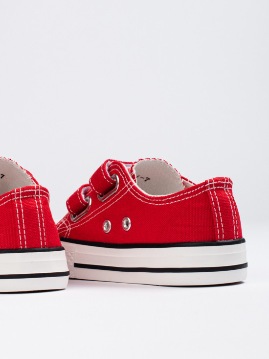 Red children's sneakers with velcro