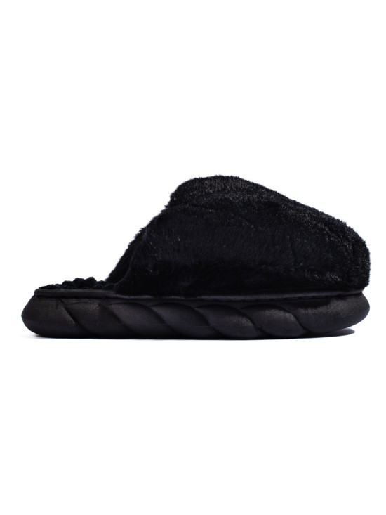 Black fur slippers on a thick sole