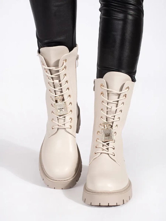 Light beige workery boots with decorative pins