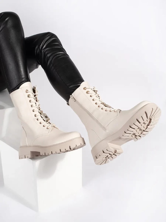 Light beige workery boots with decorative pins