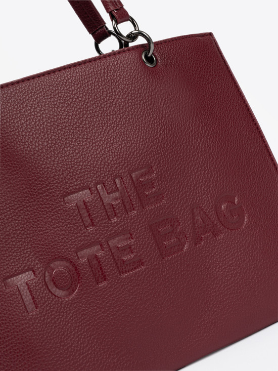 Burgundy tote bag with embossed lettering
