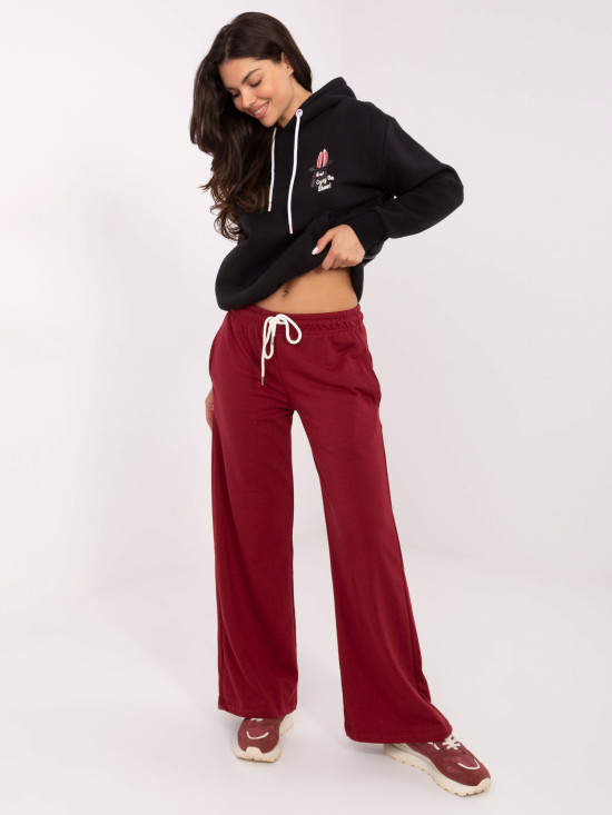 Burgundy sweatpants with wide legs