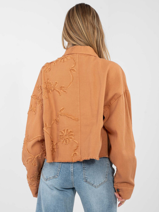 Short orange denim jacket with floral appliqué