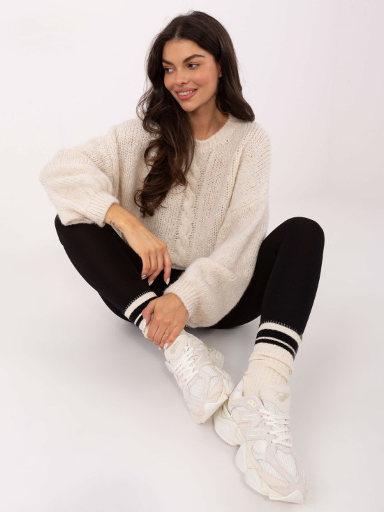 Beige sweater with round neckline and textured pattern