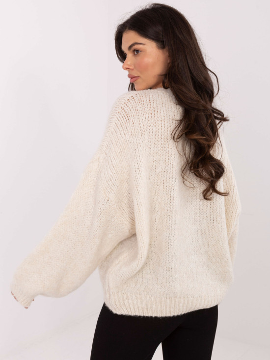 Beige sweater with round neckline and textured pattern