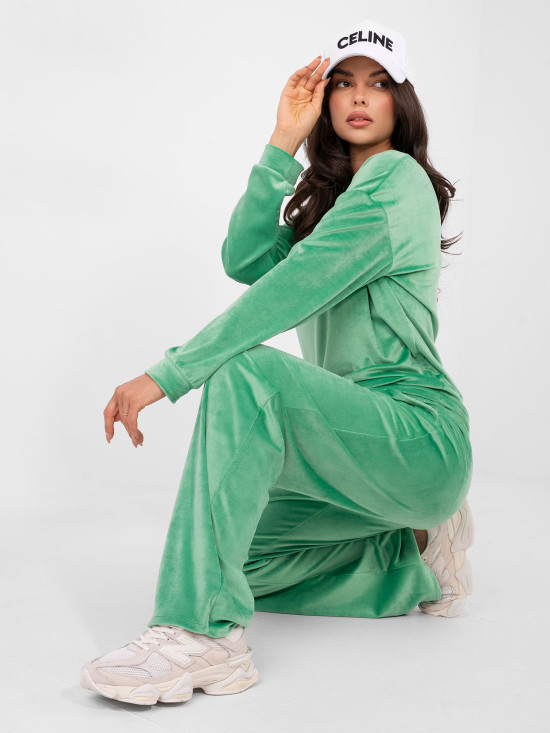 Women's green set with long sleeves and decorative details