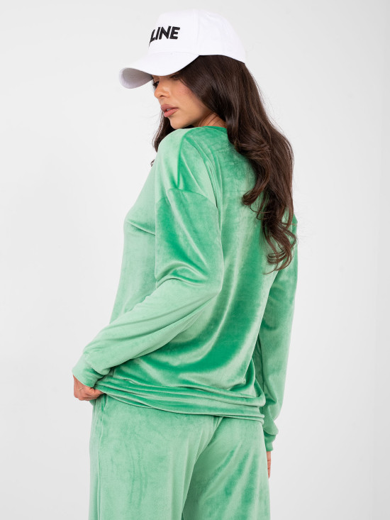 Women's green set with long sleeves and decorative details