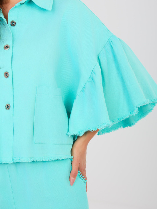 Short denim jacket with ruffle in turquoise