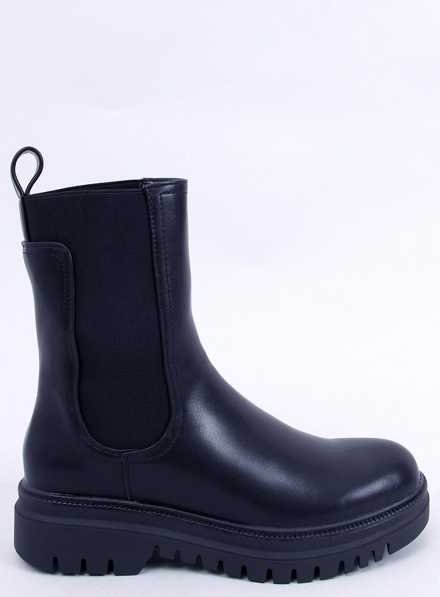 Black boots made of eco-leather on the platform