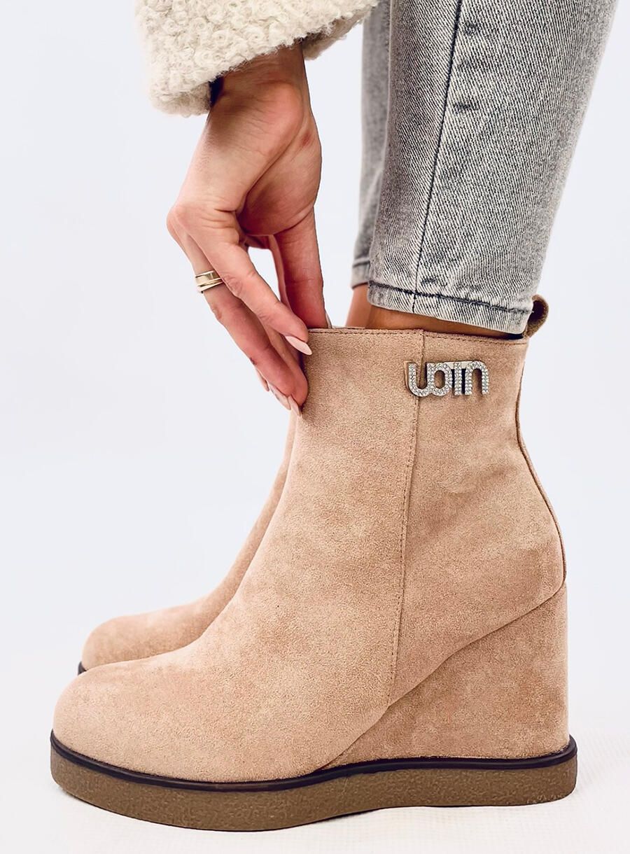 Beige ankle boots on a wedge heel