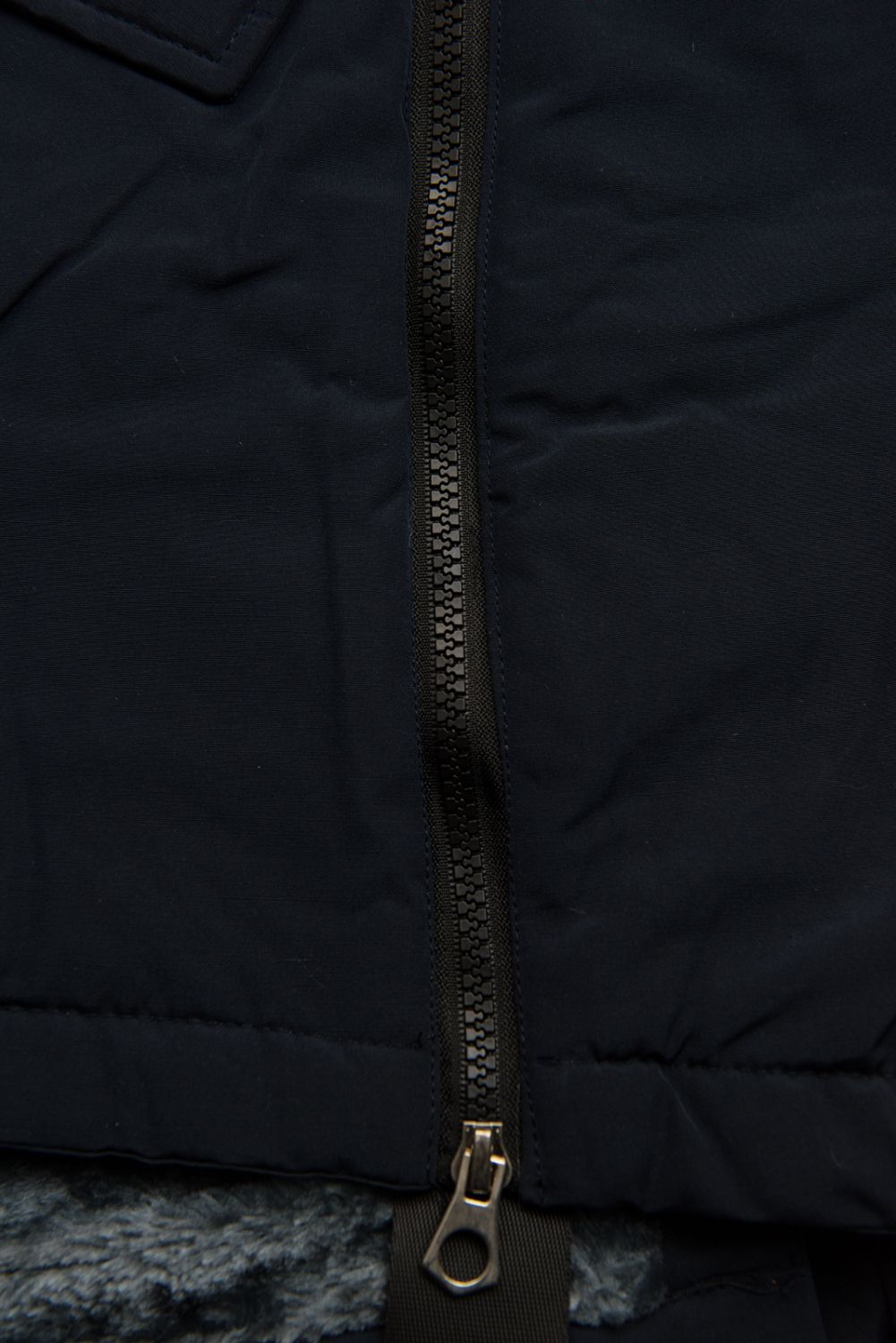 Navy winter jacket with a stand-up collar