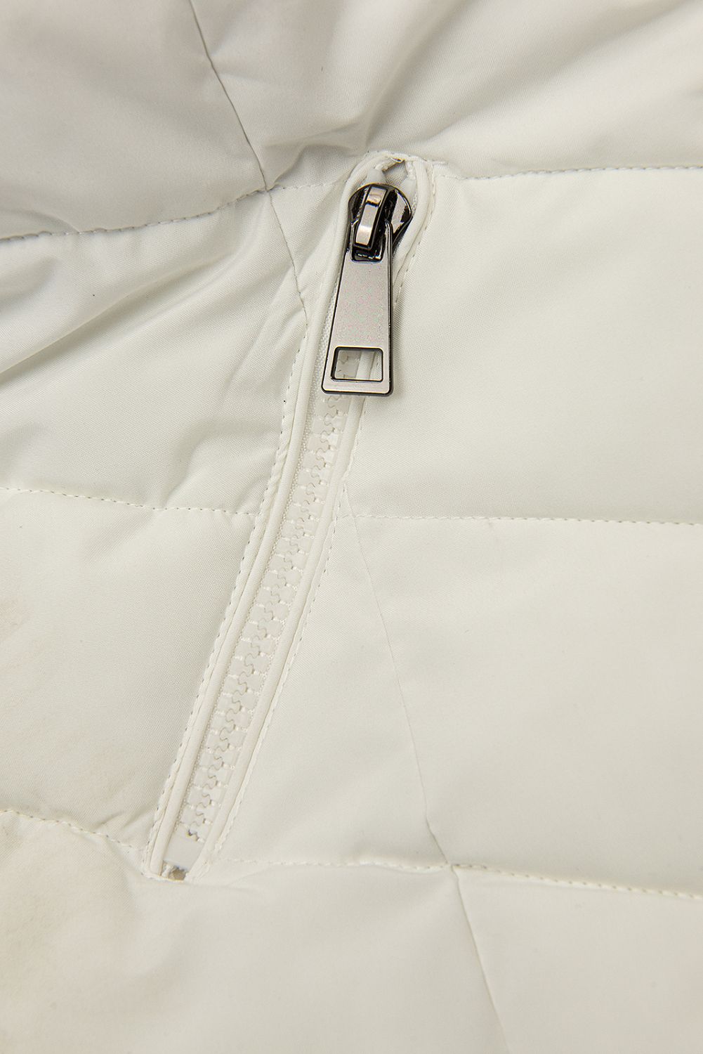 Creamy white winter jacket shaped for wider hips