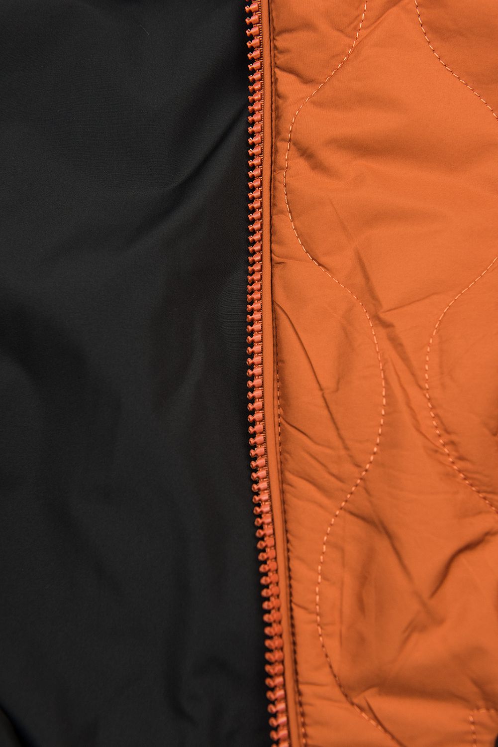 Reversible quilted parka orange/black
