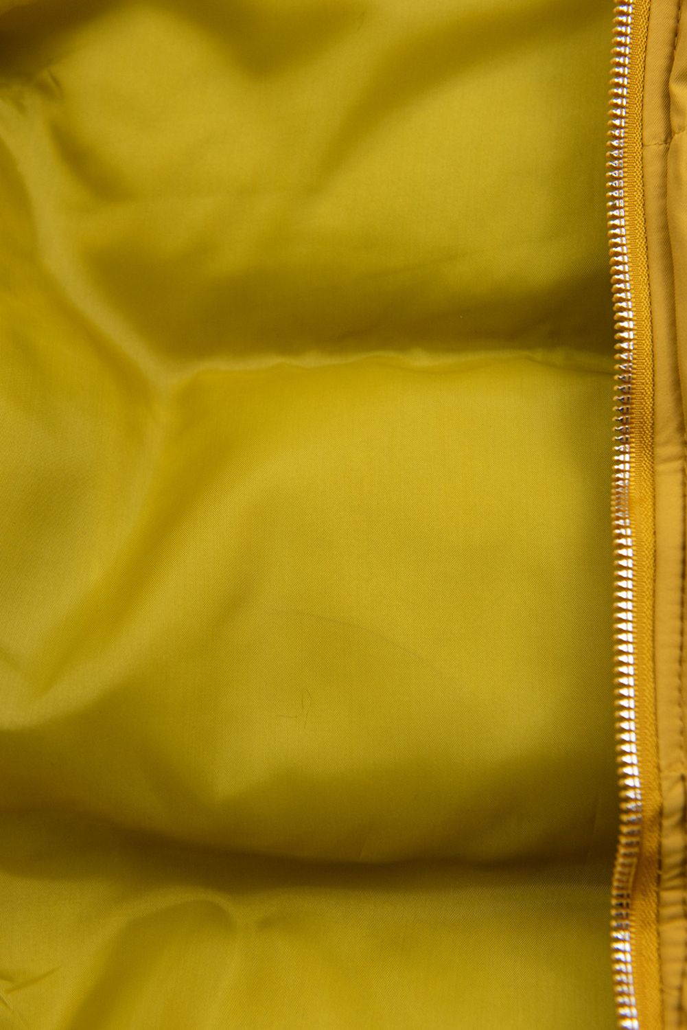 Yellow quilted vest with hood
