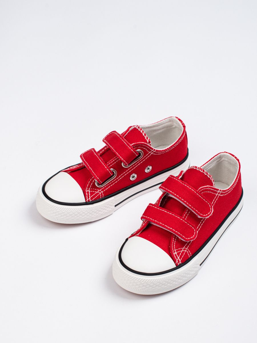 Red children's sneakers with velcro