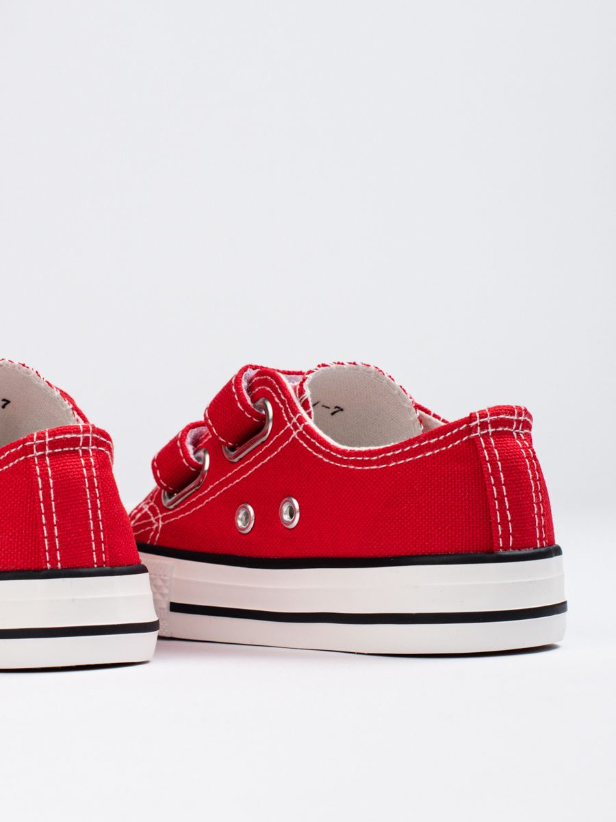 Red children's sneakers with velcro