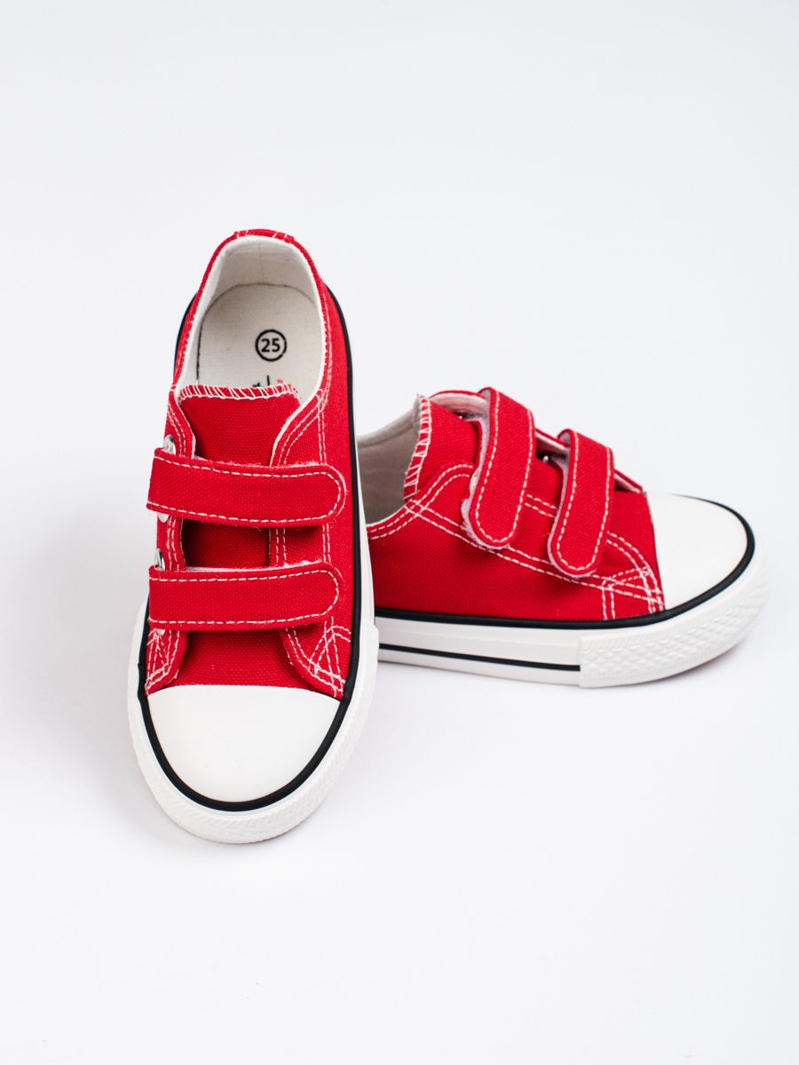 Red children's sneakers with velcro