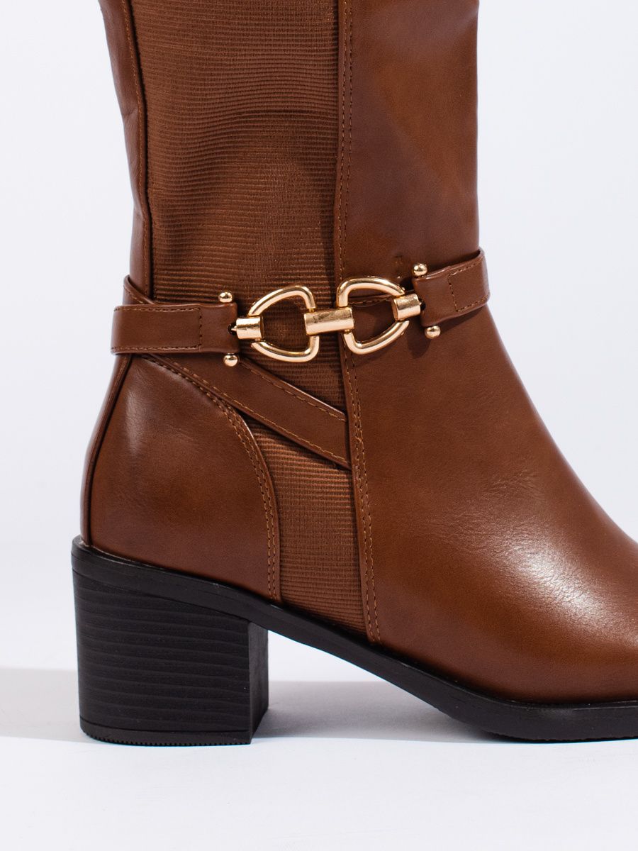 Brown boots with decorative buckle