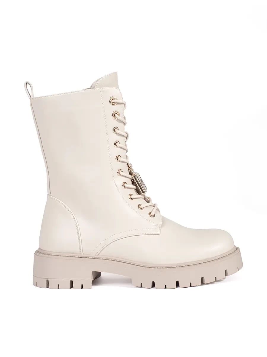 Light beige workery boots with decorative pins