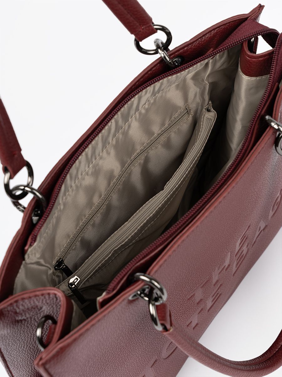Burgundy tote bag with embossed lettering
