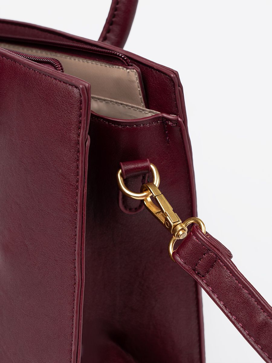 Burgundy Handbag with Decorative Gold Buckle