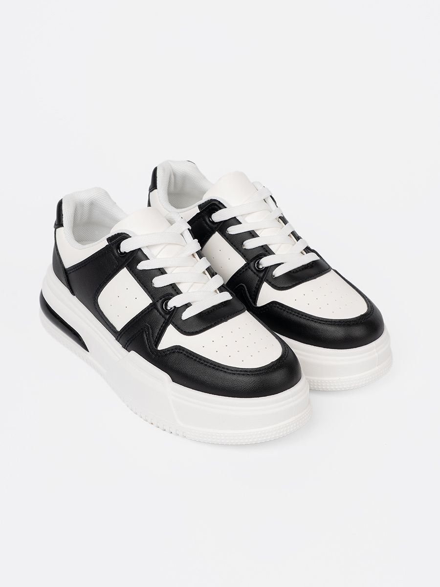 Stylish Black and White Sneakers with Thick Sole