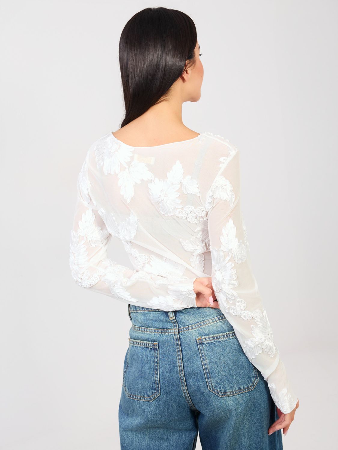 Elegant white blouse with floral appliqué and embroidery