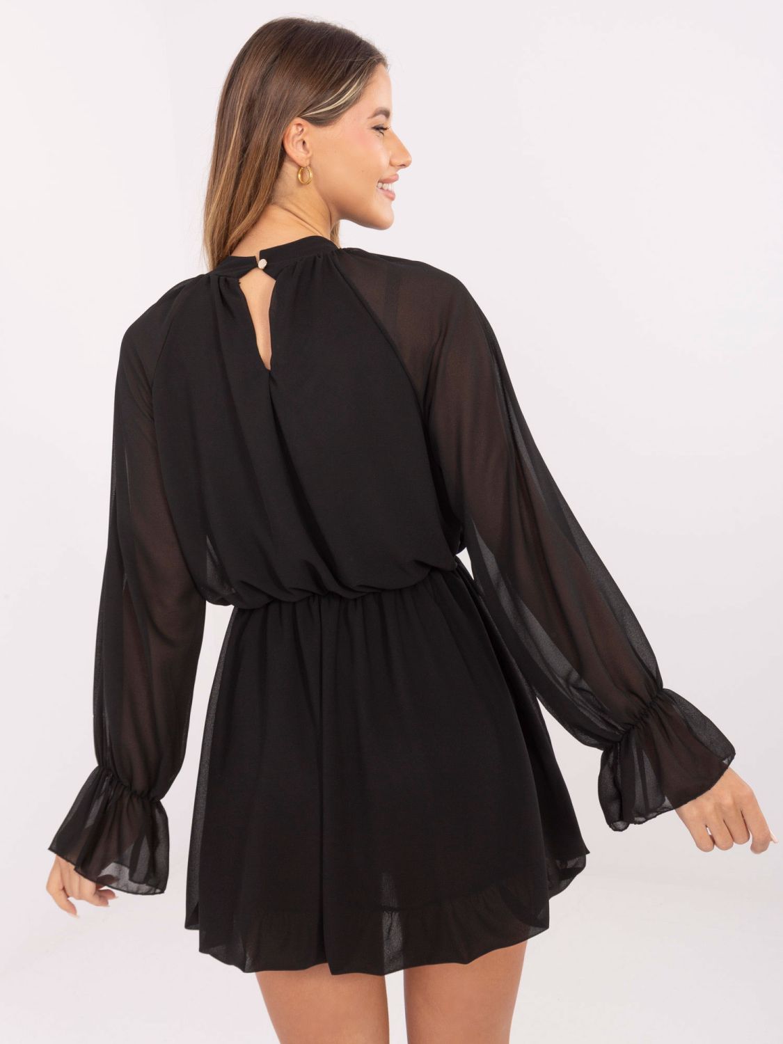 Black flared mini dress with ruffle and jabot