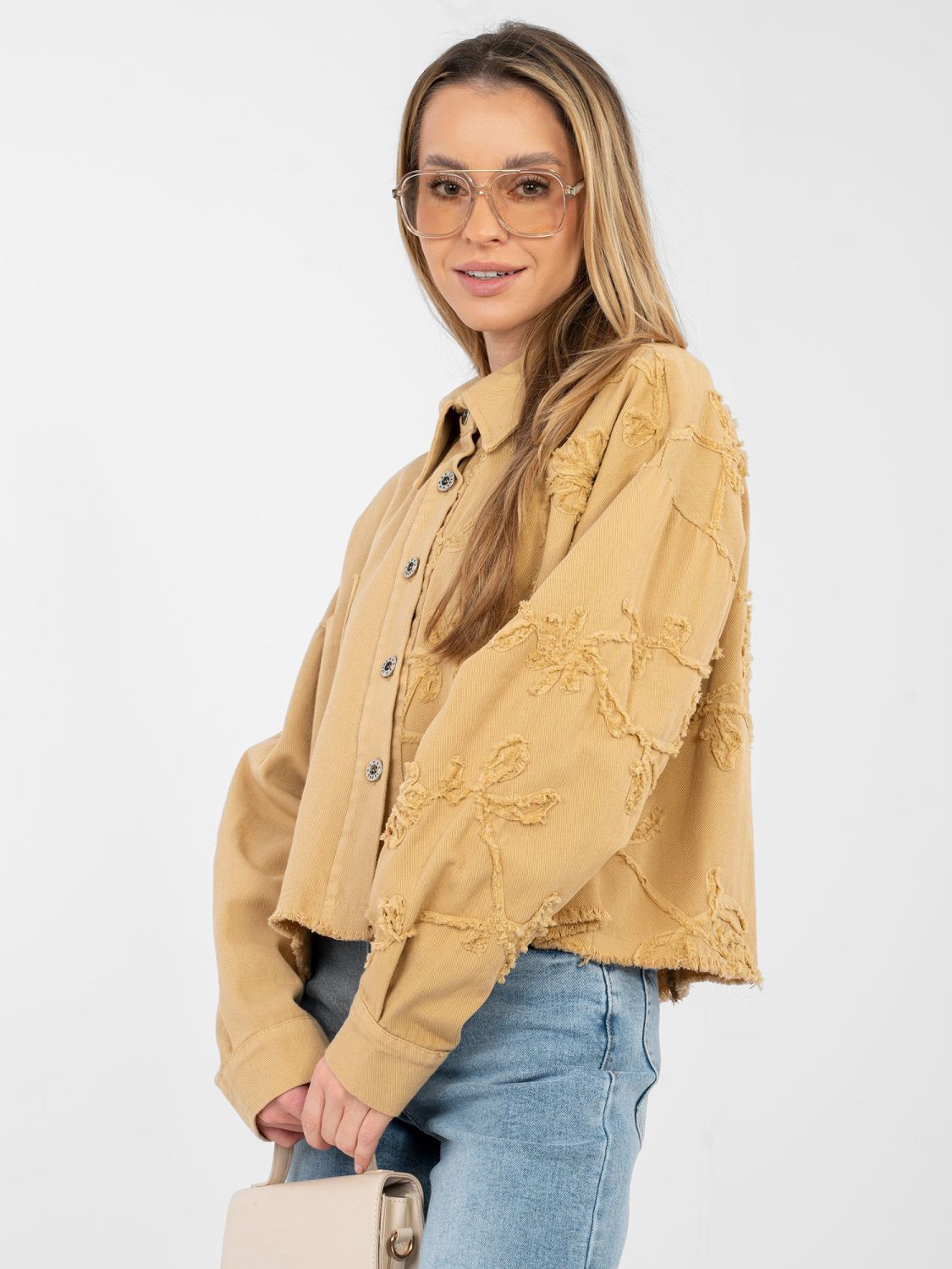 Short brown denim jacket with floral appliqué