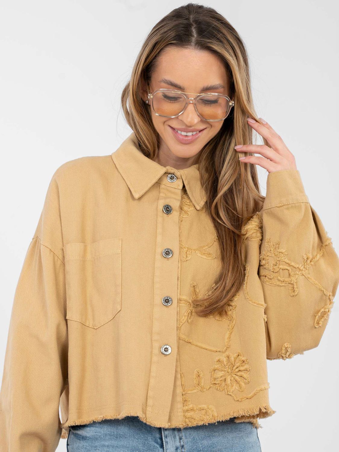 Short brown denim jacket with floral appliqué