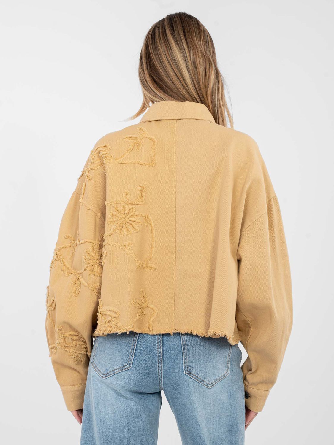 Short brown denim jacket with floral appliqué