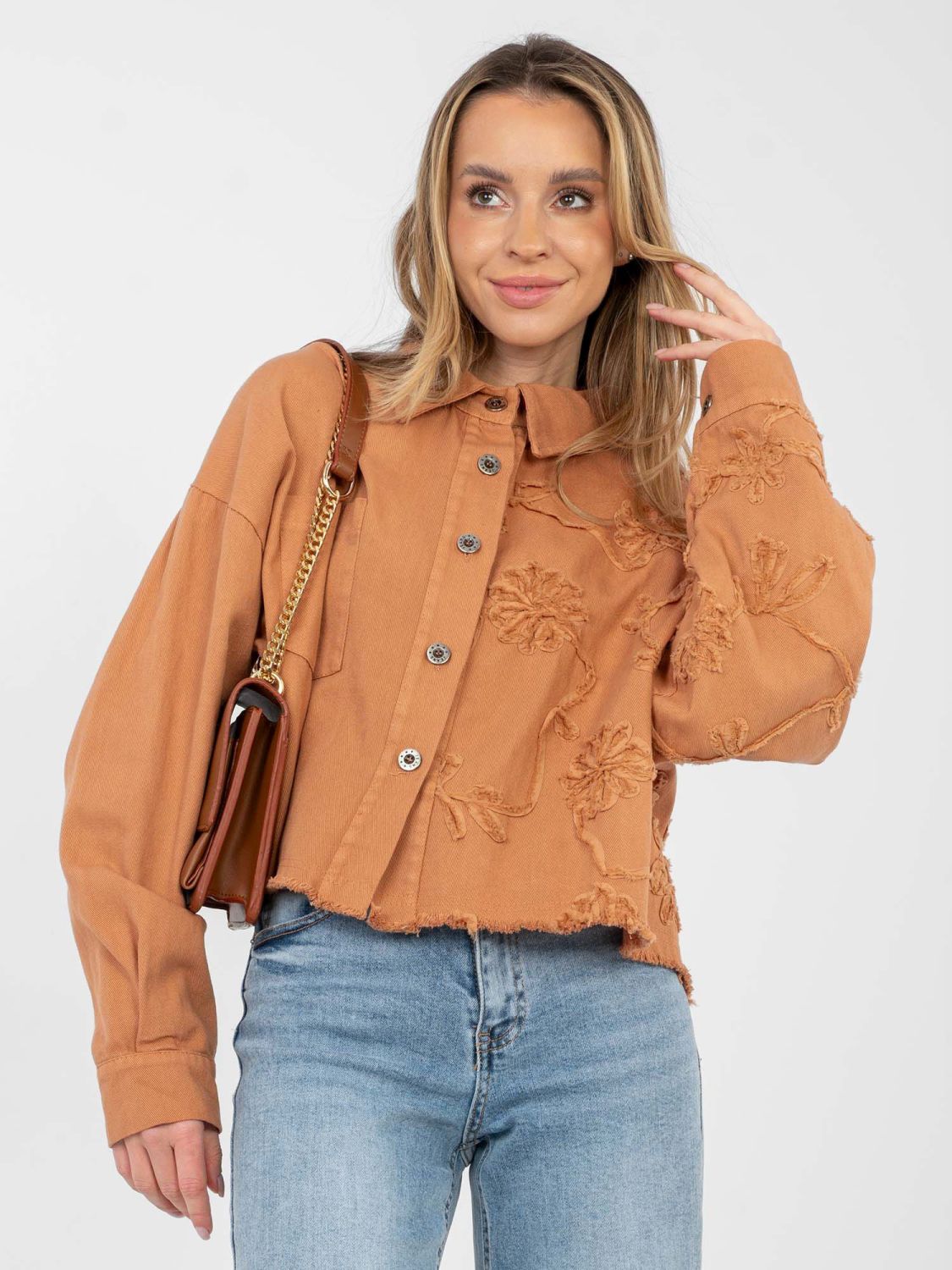 Short orange denim jacket with floral appliqué