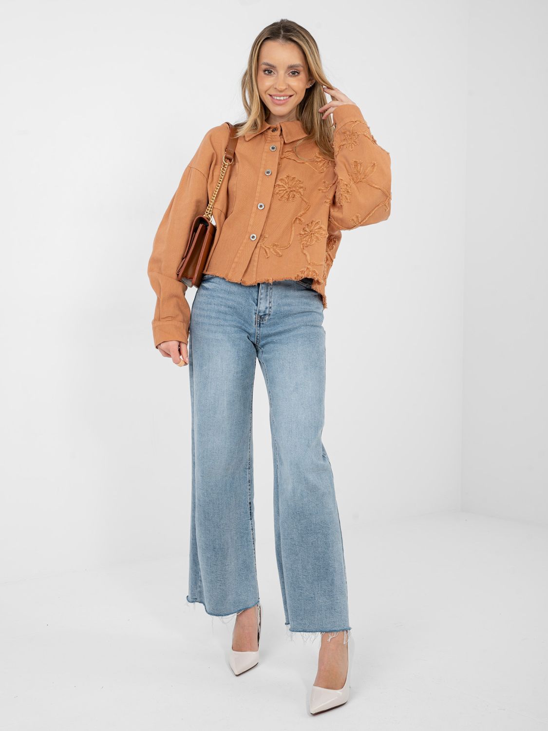 Short orange denim jacket with floral appliqué