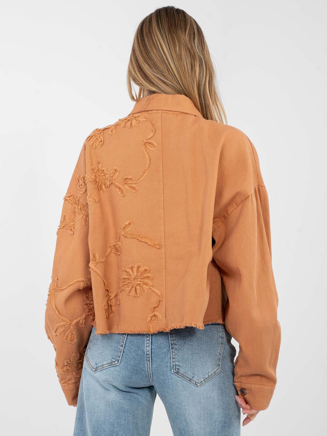 Short orange denim jacket with floral appliqué
