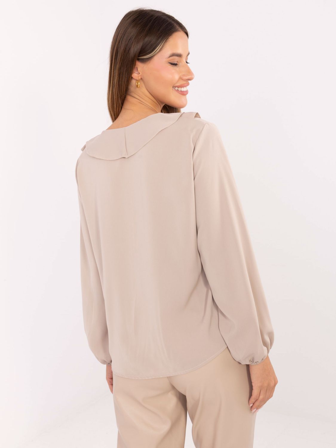 Elegant beige blouse with ruffle and puff sleeves
