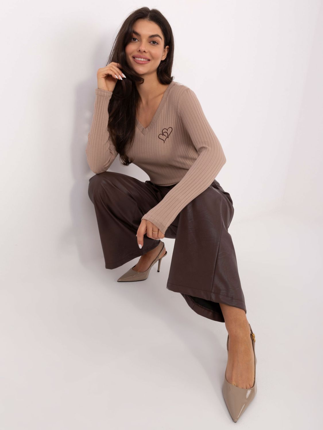 Beige blouse with embroidery and V-neckline