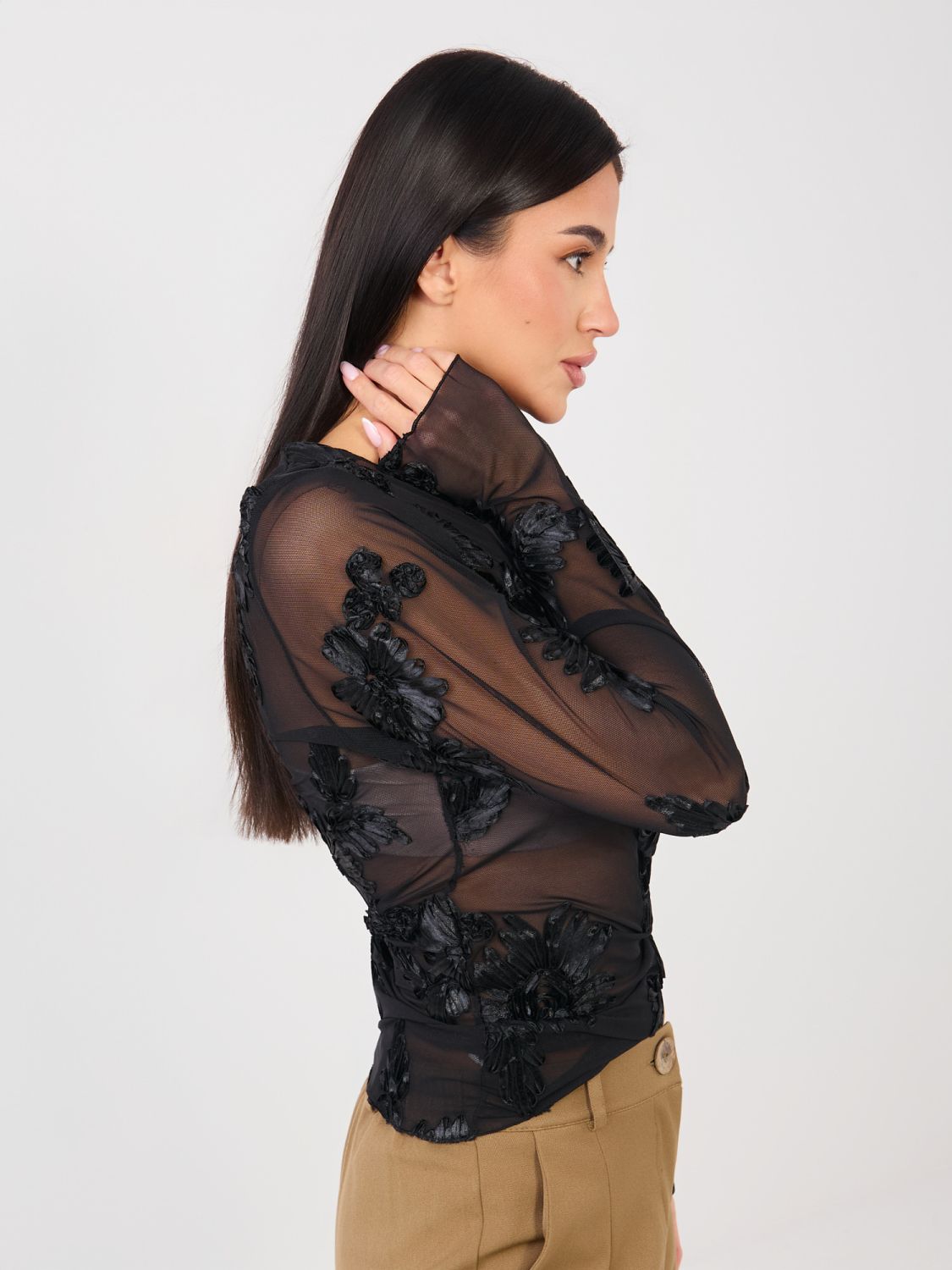 Elegant black blouse with floral appliqué and embroidery