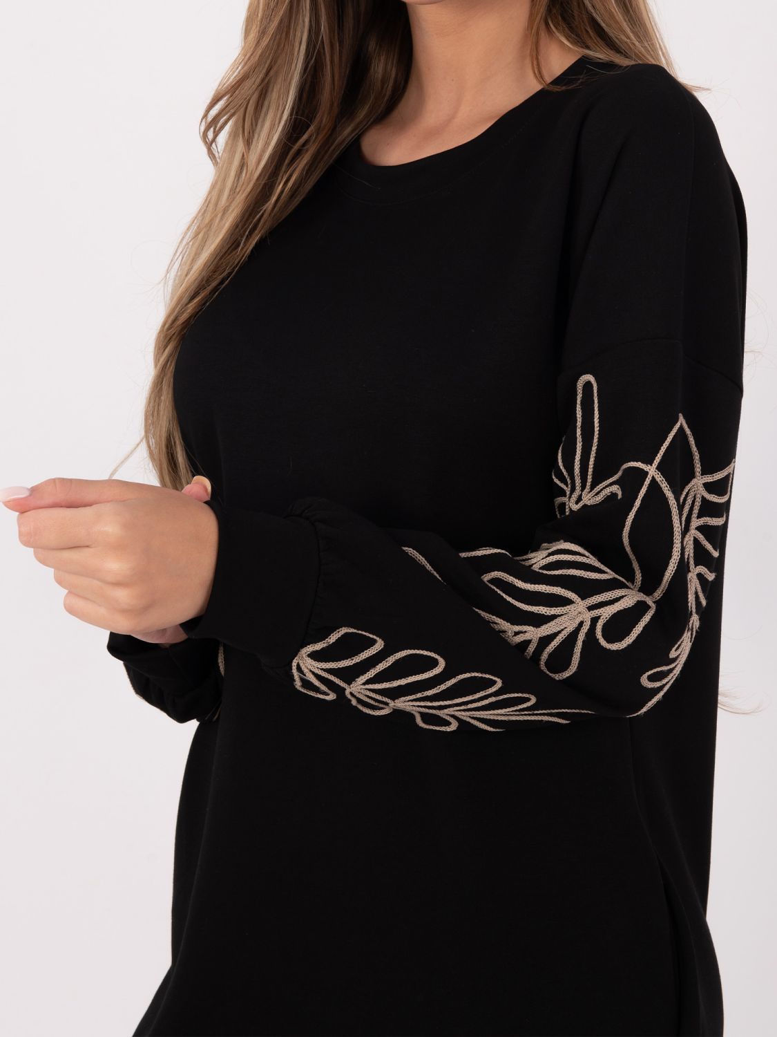 Short black dress with embroidery and puff sleeves
