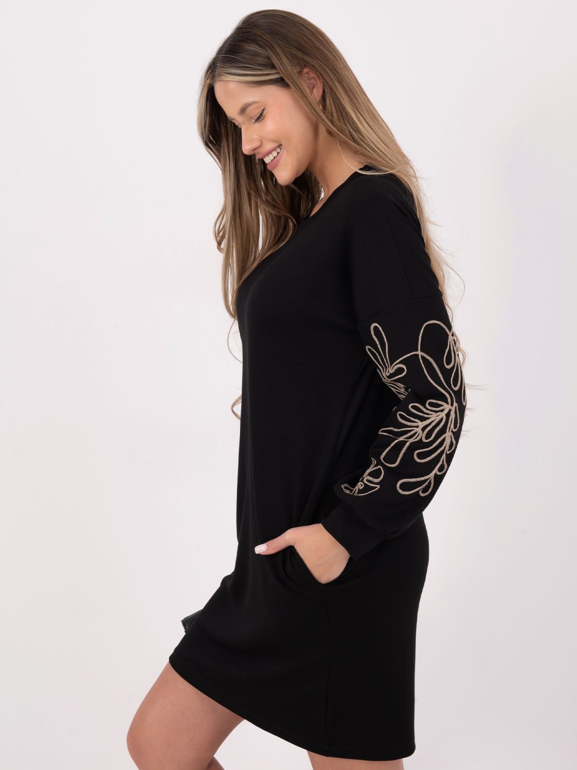 Short black dress with embroidery and puff sleeves