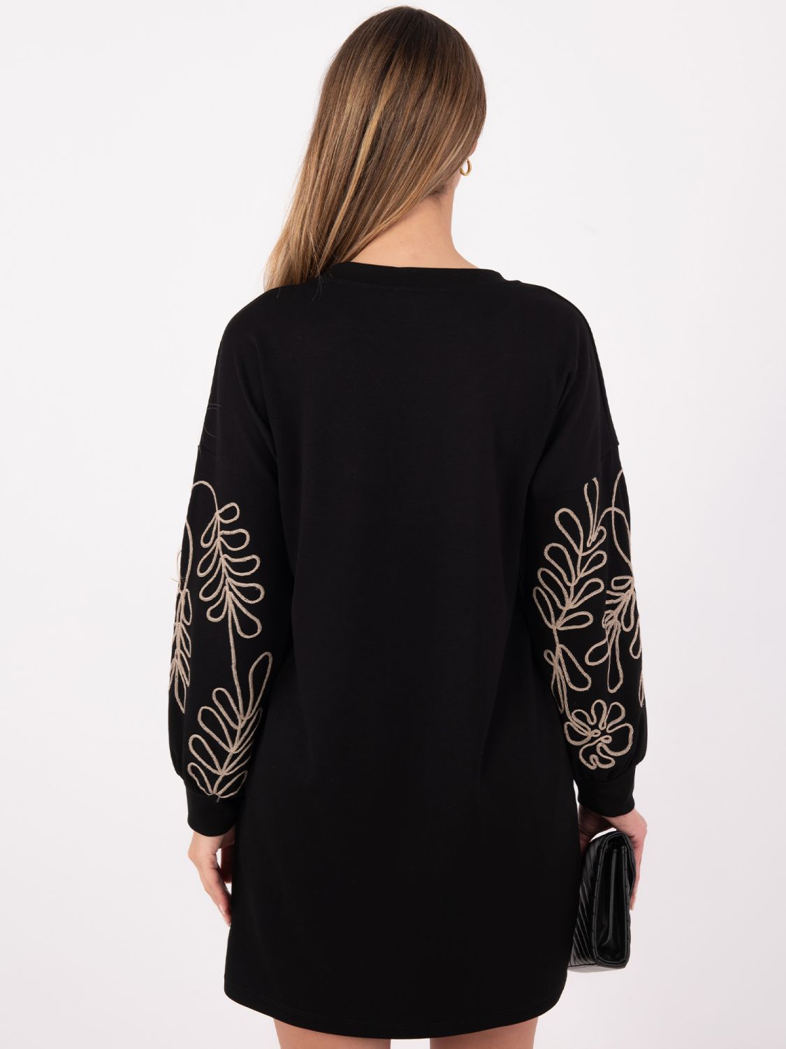 Short black dress with embroidery and puff sleeves