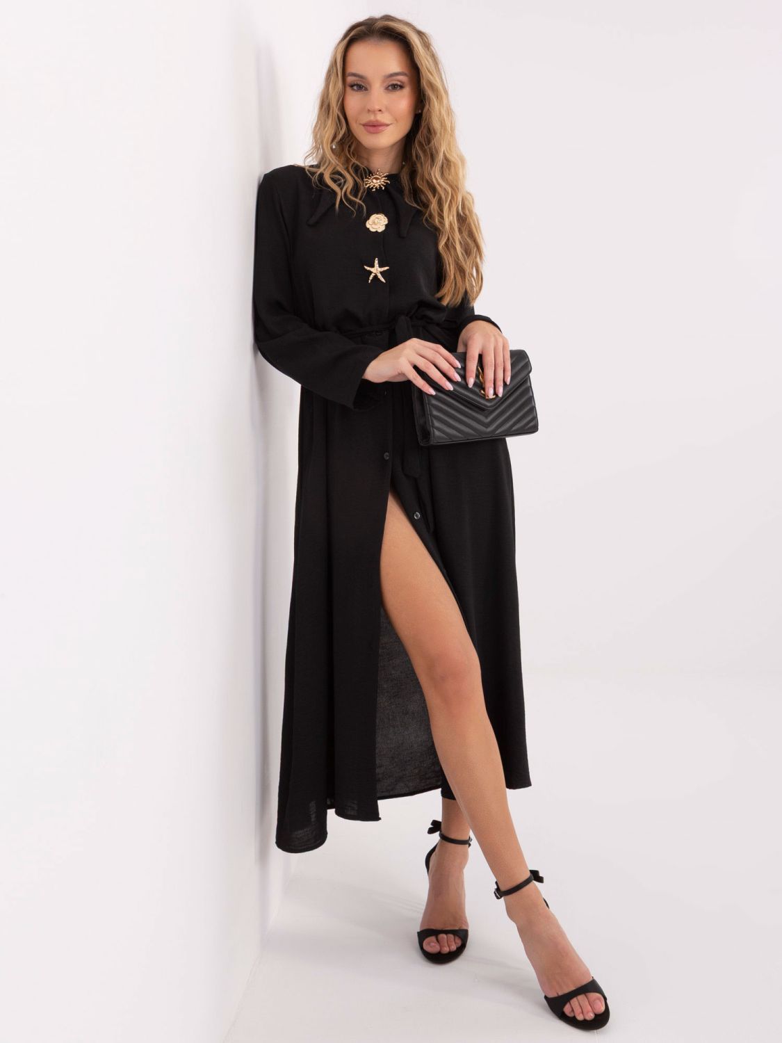 Black flared midi dress with belt and brooch