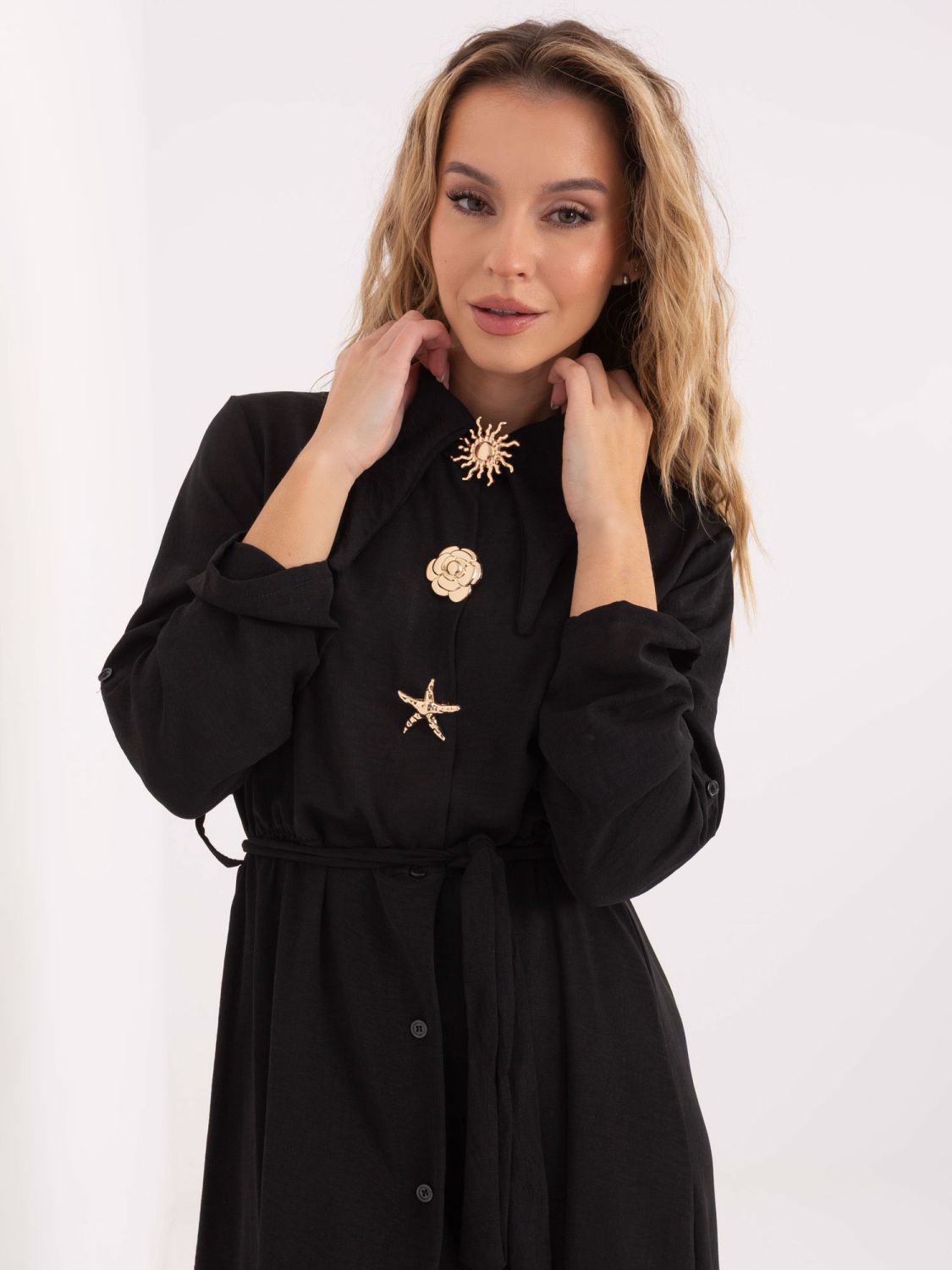 Black flared midi dress with belt and brooch