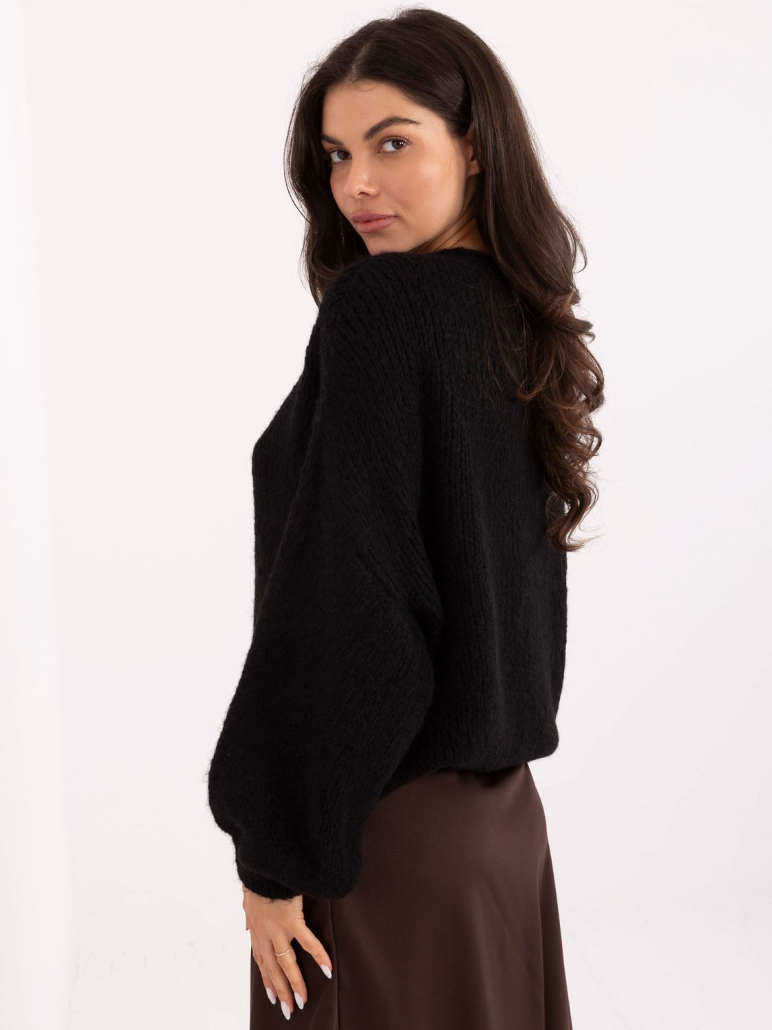Black sweater with puff sleeves and round neckline