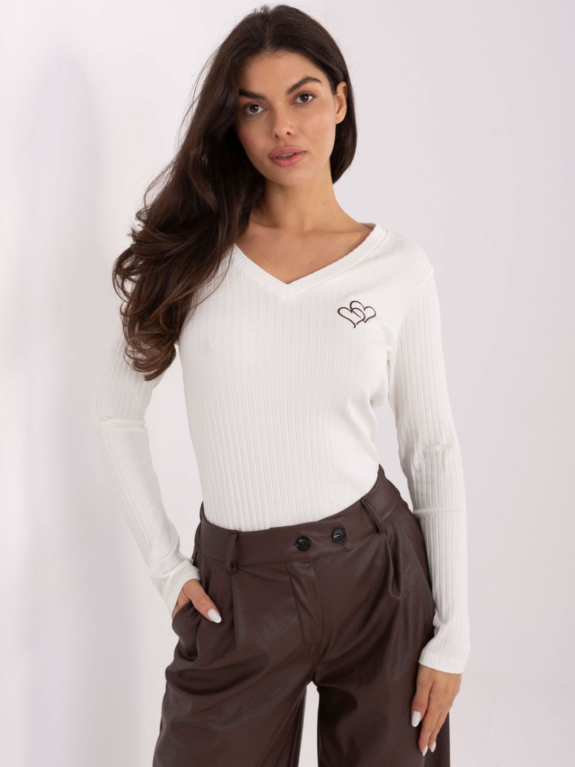 White blouse with embroidery and V-neckline